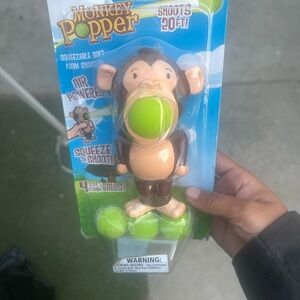 Monkey Popper Toy with Green Foam Balls new